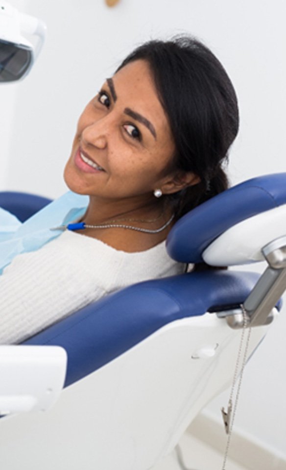 Female patient in chair waiting for a dental checkup and cleaning in Castle Rock