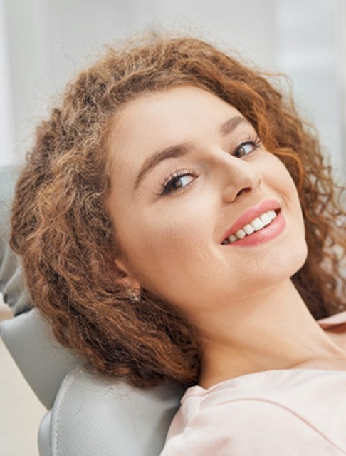 Woman leaning back in the dental chair