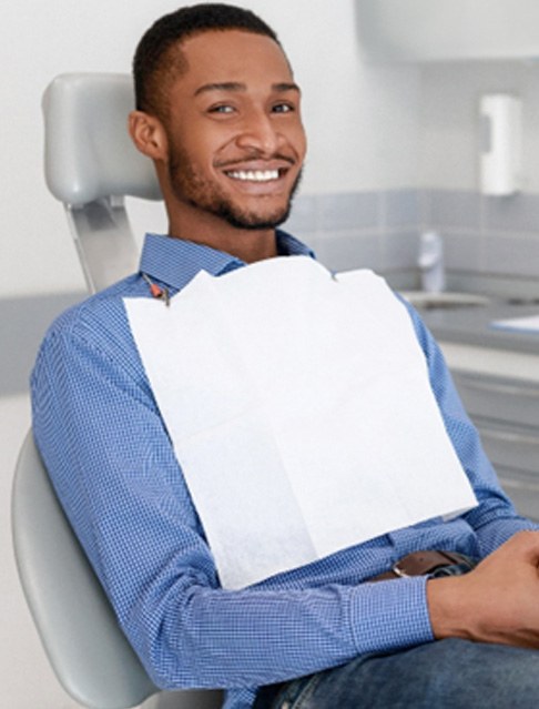 Man in dental chair after dental cleaning