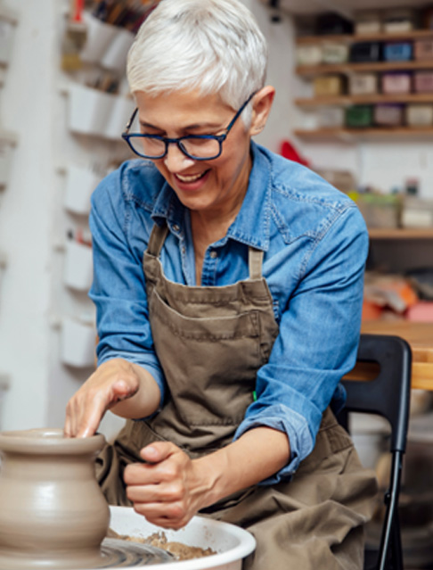 Older woman in a pottery class
