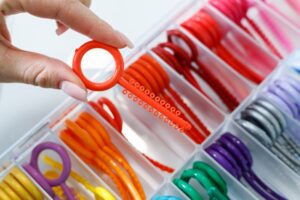 Dentist holding rubber bands for braces